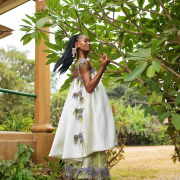 Sophisticated green silj Aline top and pants detailed with beaded and feathered appliqués on the neckline and hemline.