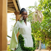 The perfect blend of structure and fluidity, this green ombré dress with pleats down and floral appliqués is the perfect statement piece.
