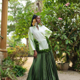 The perfect blend of structure and fluidity, this green ombré dress with pleats down and floral appliqués is the perfect statement piece.